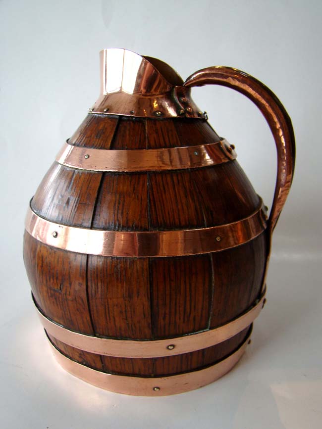 An English copper bound oak cider jug circa 1870